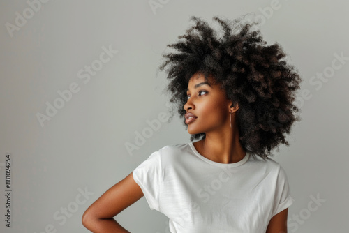  Beautiful black woman wearing bella canvas white t shirt and jeans, studio shot. Design t shirt template, print presentation mockup