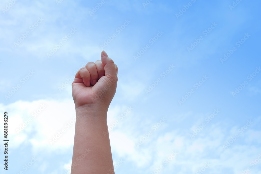 Woman hand showing something on the sky. Woman hand showing something on the sky.