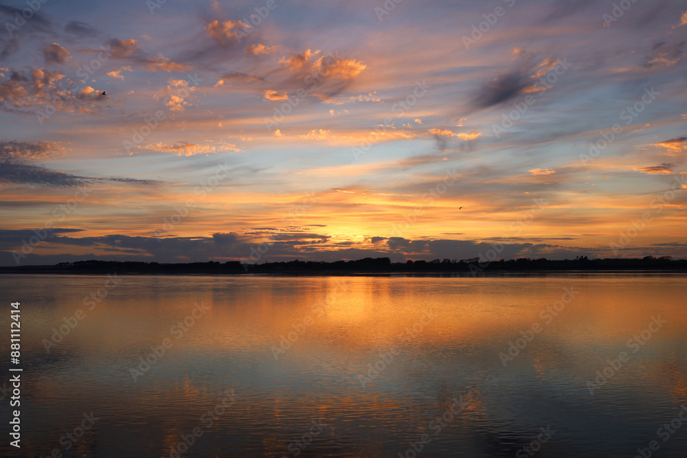 Fototapeta premium View of the sunset over the sea in Wales, UK