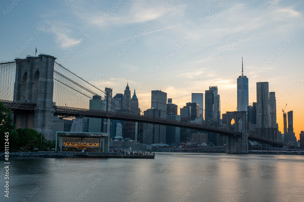 Naklejka premium New York Manhattan skyline panorama with Brooklyn Bridge view at sunset