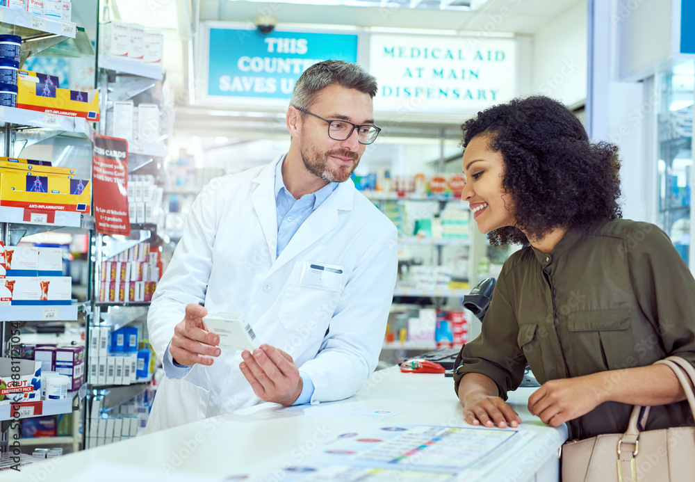 Man, pharmacist and consulting customer with box for medication or healthcare advice at pharmacy. Mature medical employee talking to shopper with pharmaceutical drugs for side effects at dispensary Man, pharmacist and consulting customer with box for medication or healthcare advice at pharmacy. Mature medical employee talking to shopper with pharmaceutical drugs for side effects at dispensary