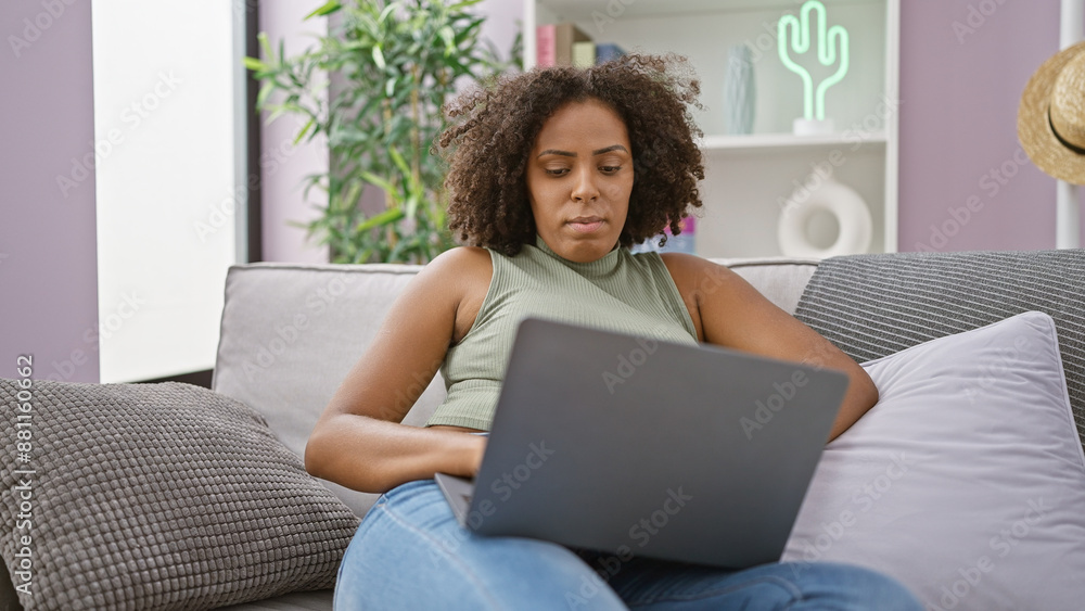 African american woman working on laptop at home African american woman working on laptop at home