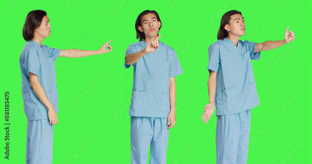 Obraz premium Medical assistant doing no symbol on camera, showing negative reaction and disagreement. Asian healthcare worker being displeased about something, disagreeing and disapproving.