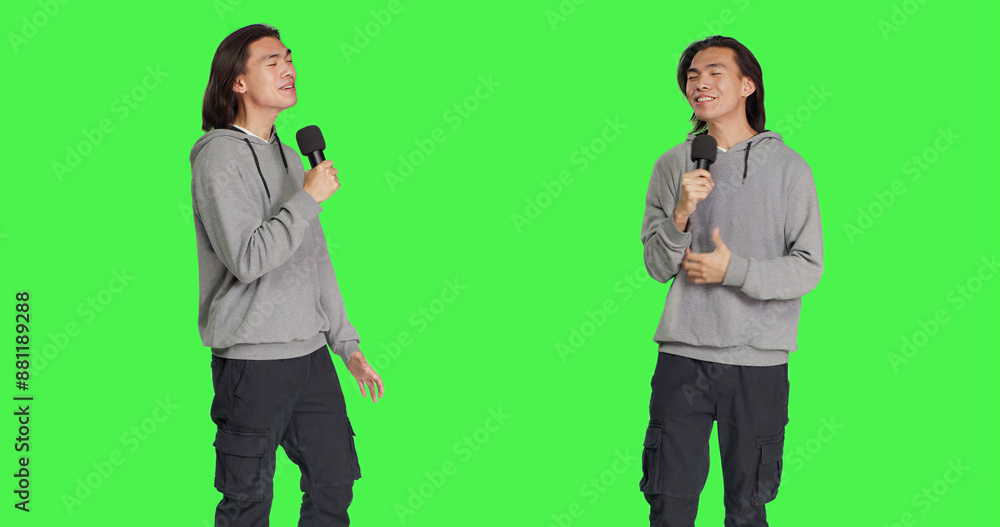 Cool person doing karaoke session on camera, using microphone to sing modern songs and lyrics. Young adult having fun over greenscreen backdrop, creating music and singing tunes. Cool person doing karaoke session on camera, using microphone to sing modern songs and lyrics. Young adult having fun over greenscreen backdrop, creating music and singing tunes.