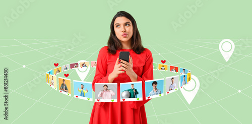 Thoughtful young woman with mobile phone on green background. Online dating c...