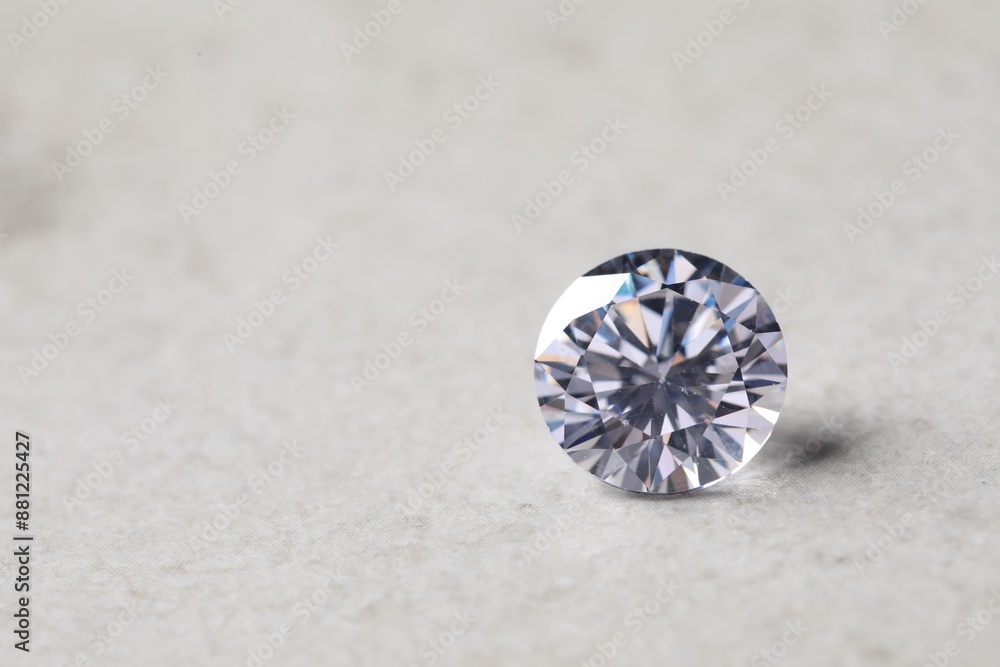One beautiful shiny diamond on light background, closeup. Space for text One beautiful shiny diamond on light background, closeup. Space for text