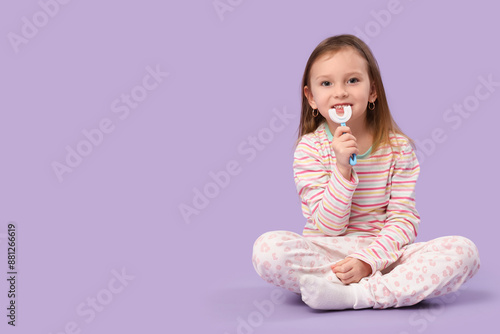 Happy little girl in pajama...