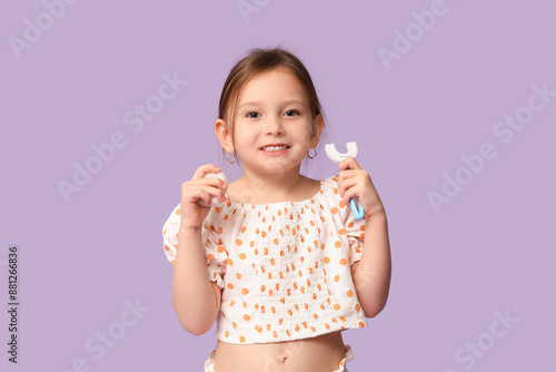 Happy little girl in pajama...