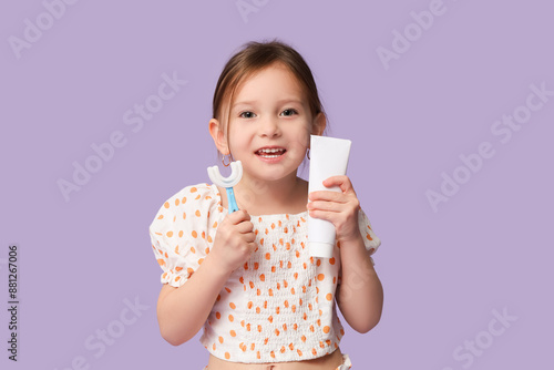 Happy little girl in pajama...