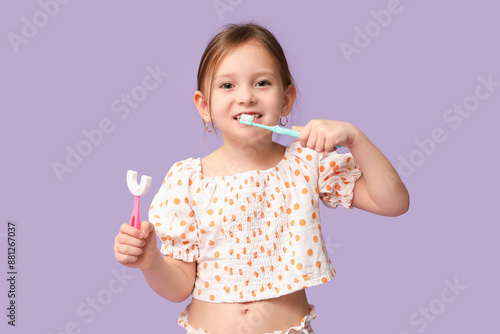 Happy little girl in pajama...