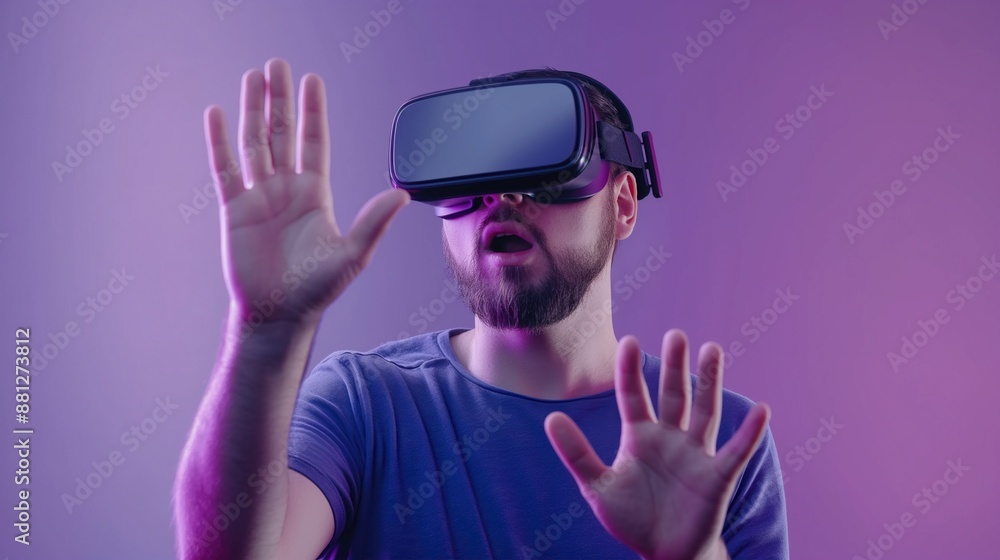 man in VR glasses, trying to touch virtual reality on violet background man in VR glasses, trying to touch virtual reality on violet background