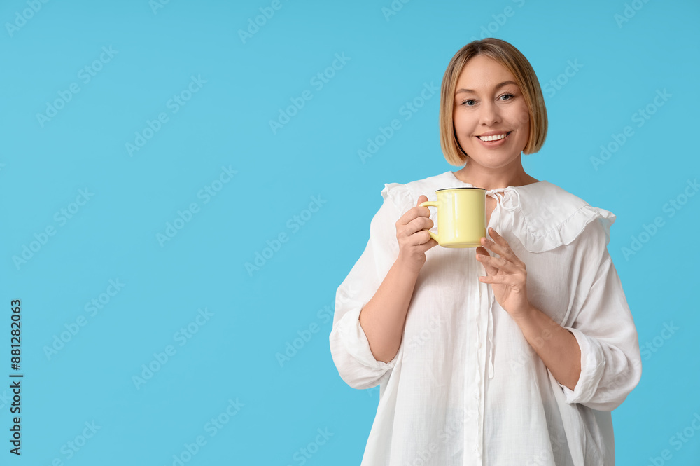 Happy adult woman with cup of coffee on blue background Happy adult woman with cup of coffee on blue background