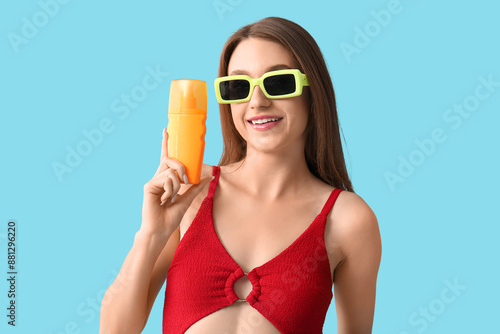 Young woman with sunscreen ...