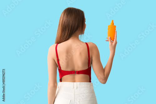 Young woman with sunscreen ...