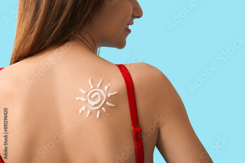 Young woman with sunscreen ...