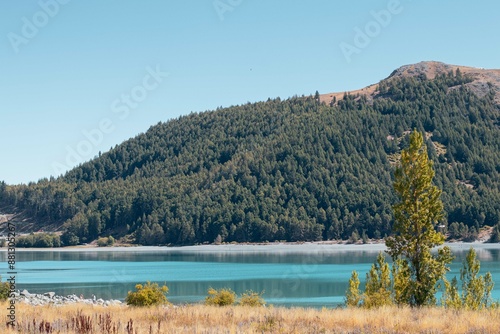 View of a Lake Tekapo and a mountain in the background, Tekapo, New Zealand photo