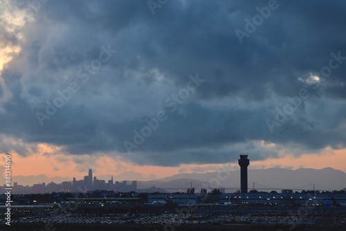 Oakland airport parking lot vieiw with san francisco bay bridge and skyline sunset