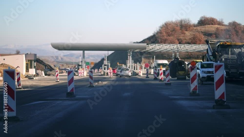 Wallpaper Mural Pov drive on busy street with a construction zone building pay tall station. The construction zone is marked with orange and white barriers Torontodigital.ca