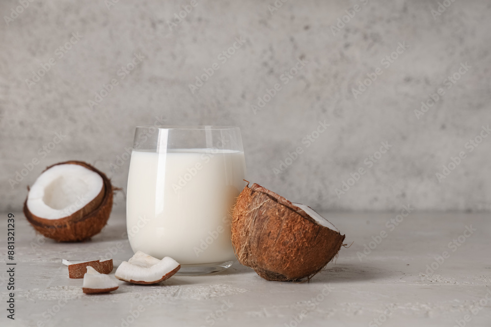 Glass of tasty coconut milk on grunge background, closeup Glass of tasty coconut milk on grunge background, closeup