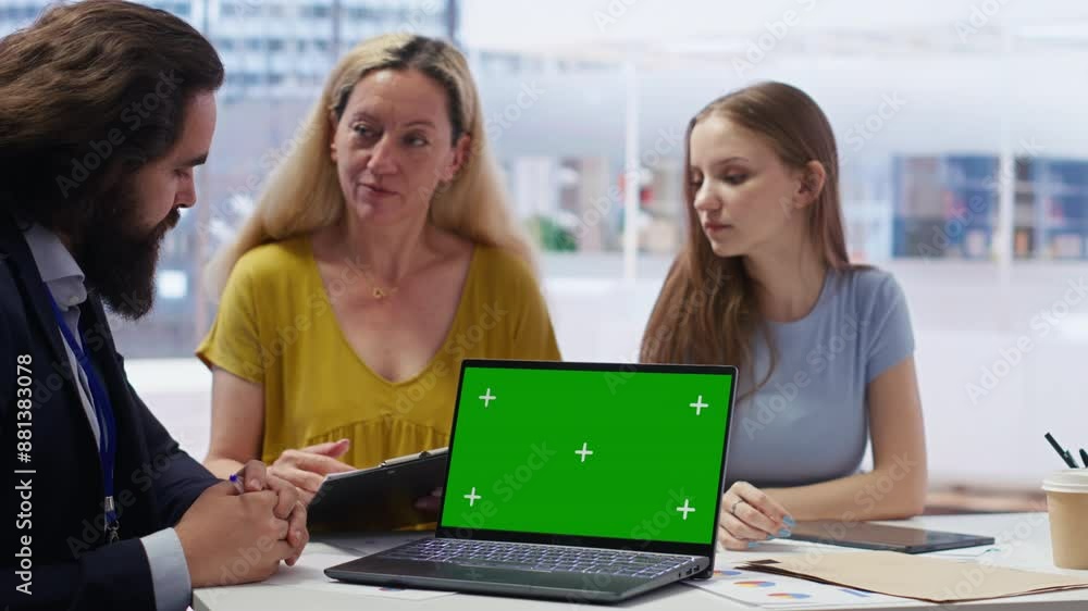 Clients looking over personalized planning guide on green screen laptop written by financial advisor during meeting. Consultant optimizing living expenses for customers using mockup notebook, camera B Clients looking over personalized planning guide on green screen laptop written by financial advisor during meeting. Consultant optimizing living expenses for customers using mockup notebook, camera B