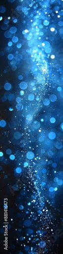 A blue and gold bokeh blur background with lights. 