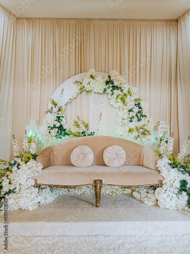 Bridal dais, wedding stage decoration built for the bride and groom on their wedding day. The couple will sit on the dais or pelamin. photo