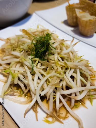 Stir-fried bean sprouts on white background. photo