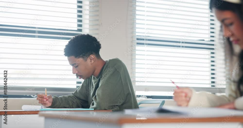 Answer, exam and thinking with student in classroom of school for assessment, problem solving or university test. Education, solution and question with teen boy in class for development or growth Answer, exam and thinking with student in classroom of school for assessment, problem solving or university test. Education, solution and question with teen boy in class for development or growth