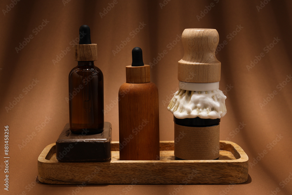 Men's shaving tools, soap and cosmetics bottles on brown background Men's shaving tools, soap and cosmetics bottles on brown background