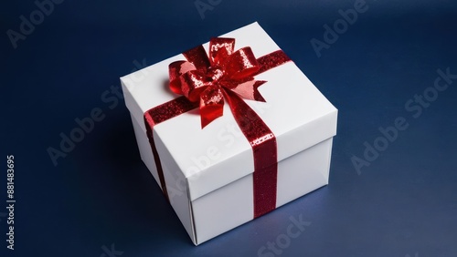 a white box with a red ribbon on it