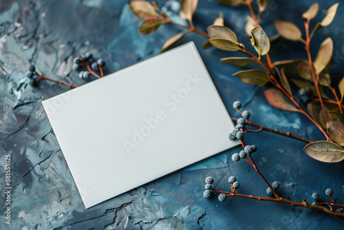 Elegant blank paper with a simple floral ornament on a blue background, ideal for customable message template photo