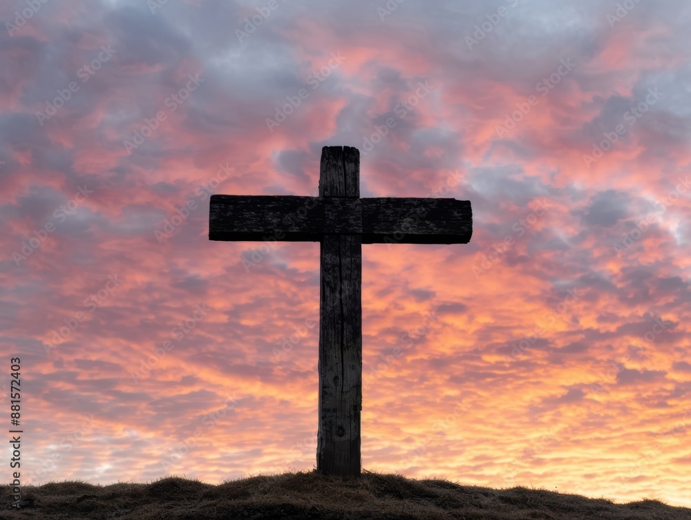 Silhouette of a wooden cross against a dramatic sunset sky Silhouette of a wooden cross against a dramatic sunset sky