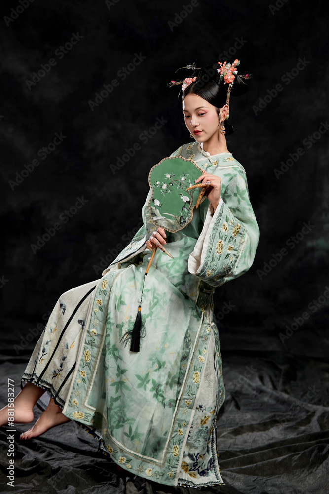 Asian,woman,showing,court,costumes,of,the,Qing,Dynasty,in,China Asian,woman,showing,court,costumes,of,the,Qing,Dynasty,in,China