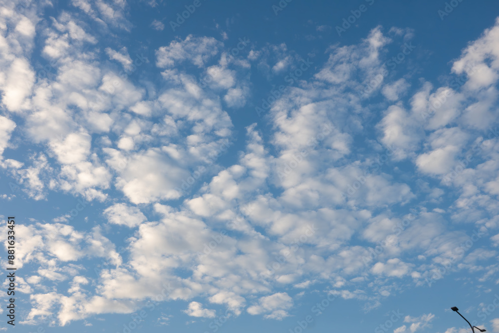 The sky is blue with many clouds. The clouds are white and fluffy. The sky is very clear and bright The sky is blue with many clouds. The clouds are white and fluffy. The sky is very clear and bright