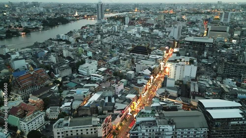 Aerial of Yaowarat Road  the Main Street of Bangkok Chinatown illuminated at night with neon sign drone fly above  photo