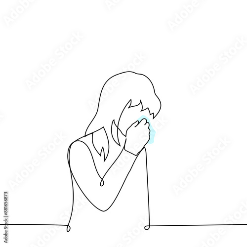 sad woman stands with her head bowed and wipes her tears with a handkerchief - one line art vector. concept quietly crying female tears, sensitive, allergy, conjunctivitis