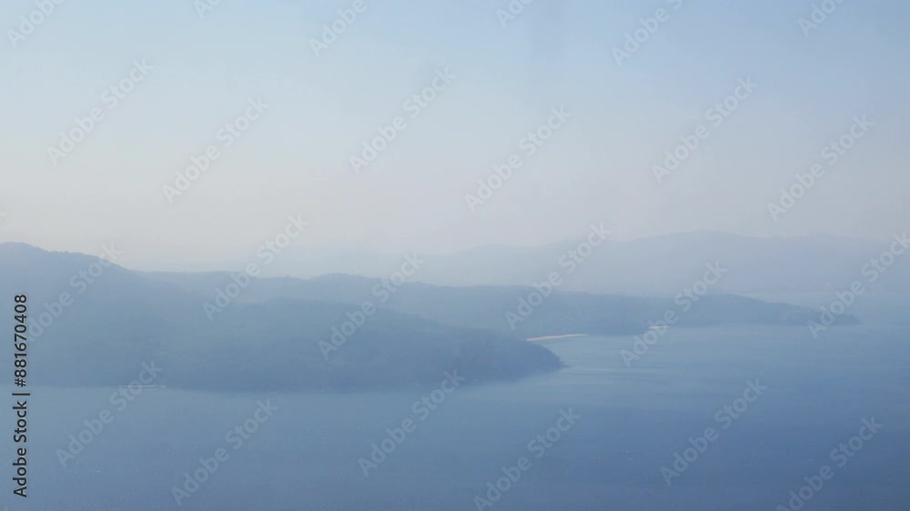 Aerial view above sea ocean blue in summer inspiration concept cinematic breathtaking from inside airplane flying over sea in high altitude, fresh clean air seaa island and blue skies on background. Aerial view above sea ocean blue in summer inspiration concept cinematic breathtaking from inside airplane flying over sea in high altitude, fresh clean air seaa island and blue skies on background.