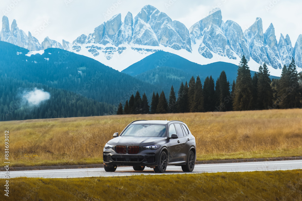Black expensive SUV journey through countryside Black expensive SUV journey through countryside