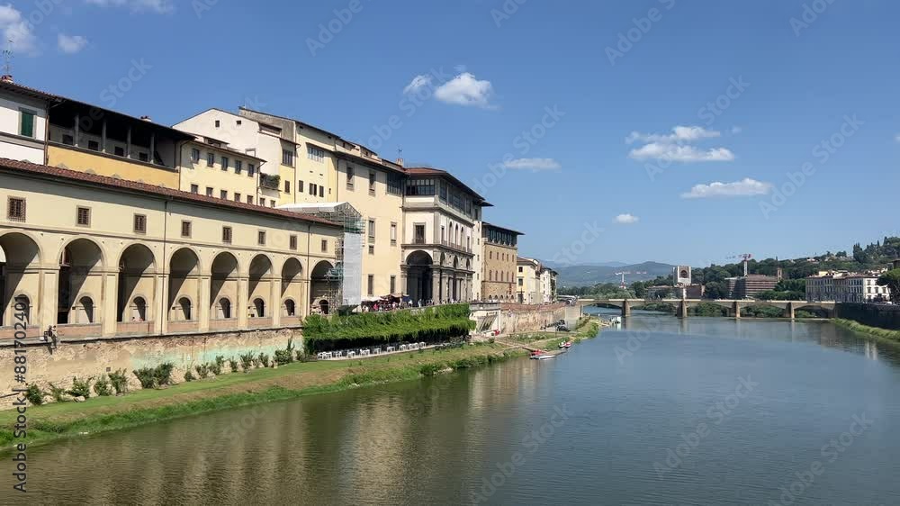 Arno river in Florence overview of the bridge in sunny day. High quality 4k footage Arno river in Florence overview of the bridge in sunny day. High quality 4k footage