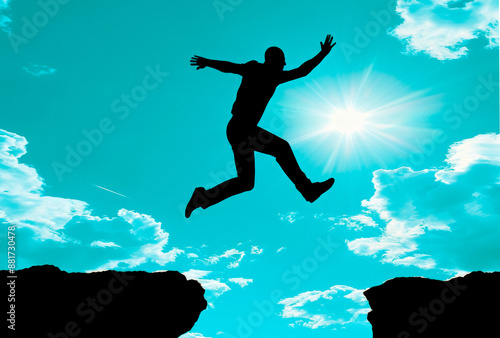 Wallpaper Mural Silhouette of a person jumping between cliffs against a blue sky with clouds and sun, concept of freedom or achievement. Generative AI Torontodigital.ca