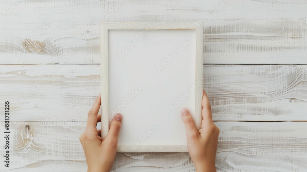 Hands Placing Blank white Photo Frames on the Wall for Mockup Hands Placing Blank white Photo Frames on the Wall for Mockup
