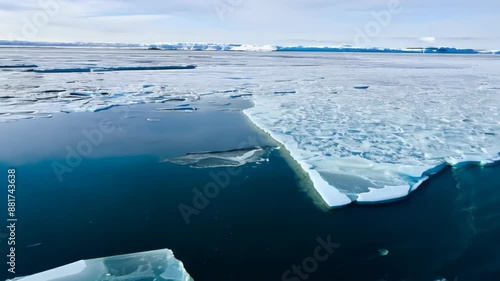 Vast Arctic ice sheet dominates. Cracks appear, widening rapidly. Ice fragments, breaking into smaller pieces. Meltwater pools form, expanding quickly. 