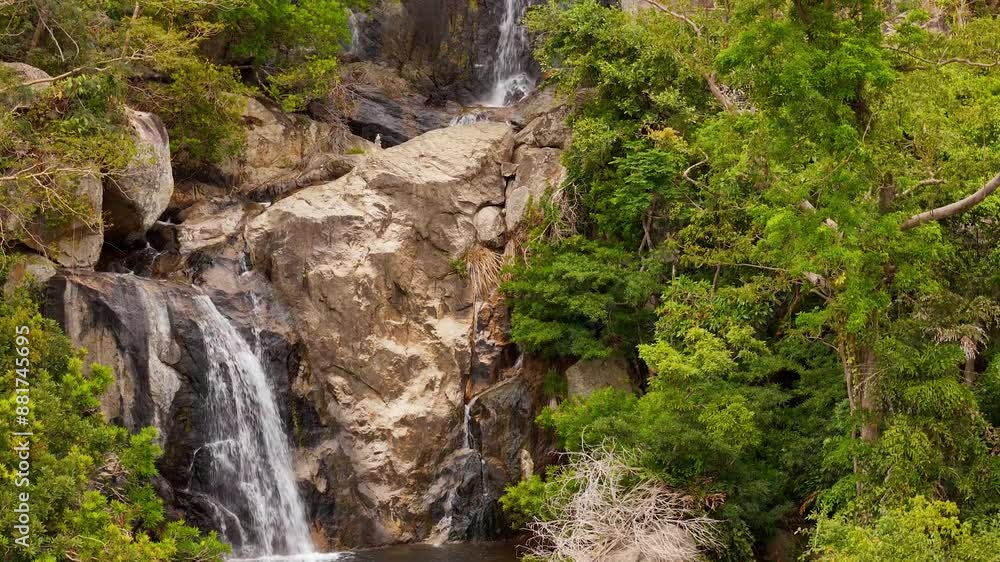 A Towering Waterfall Flowing Down The Dense Jungle Forests Of Vietnam; Nui Chua National Park Is An Oasis Full Of Natural Beauty, Biodiversity, And Geological Wonders. A Towering Waterfall Flowing Down The Dense Jungle Forests Of Vietnam; Nui Chua National Park Is An Oasis Full Of Natural Beauty, Biodiversity, And Geological Wonders.