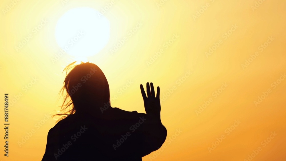 Fototapeta premium Young Woman Silhouette in Sunset