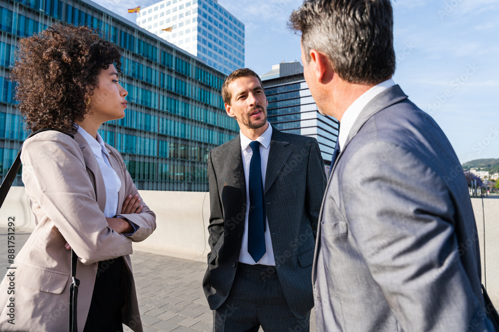 Multiracial group of business people bonding outdoors - International business corporate team wearing elegant suit meeting in a business park Multiracial group of business people bonding outdoors - International business corporate team wearing elegant suit meeting in a business park