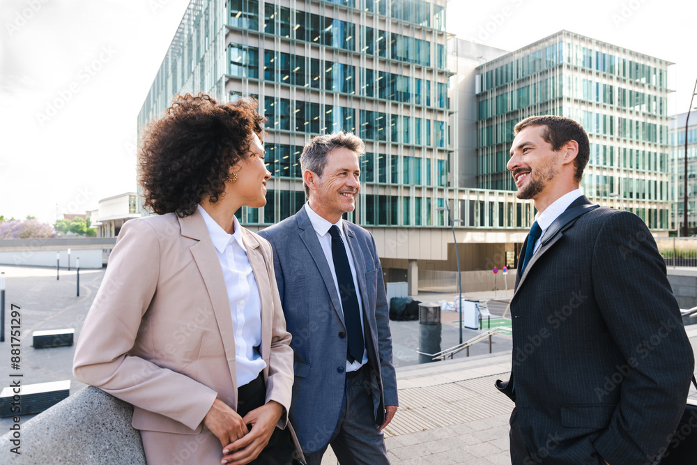 Multiracial group of business people bonding outdoors - International business corporate team wearing elegant suit meeting in a business park Multiracial group of business people bonding outdoors - International business corporate team wearing elegant suit meeting in a business park