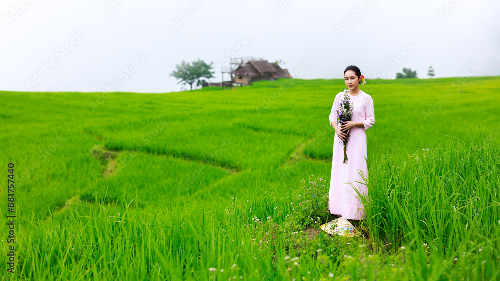 asian woman wearing Vietnam culture traditional at green rice terrace of Ban pa bong piang at morning fog in Chiangmai, Thailand. asian woman wearing Vietnam culture traditional at green rice terrace of Ban pa bong piang at morning fog in Chiangmai, Thailand.