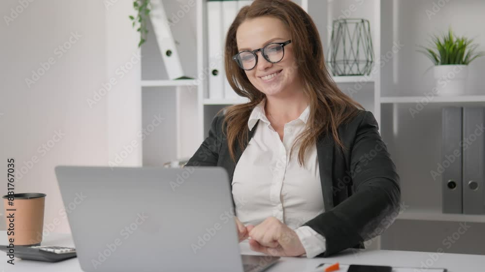 Businesswoman in glasses leaning back in chair with smile. Business heroine at the desk: technologically equipped and always ready to solve business problems. Happy office worker Businesswoman in glasses leaning back in chair with smile. Business heroine at the desk: technologically equipped and always ready to solve business problems. Happy office worker