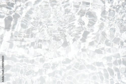 White water with ripples on the surface. Defocus blurred transparent white colored clear calm water surface texture with splashes and bubbles. Water waves with shining pattern texture background.