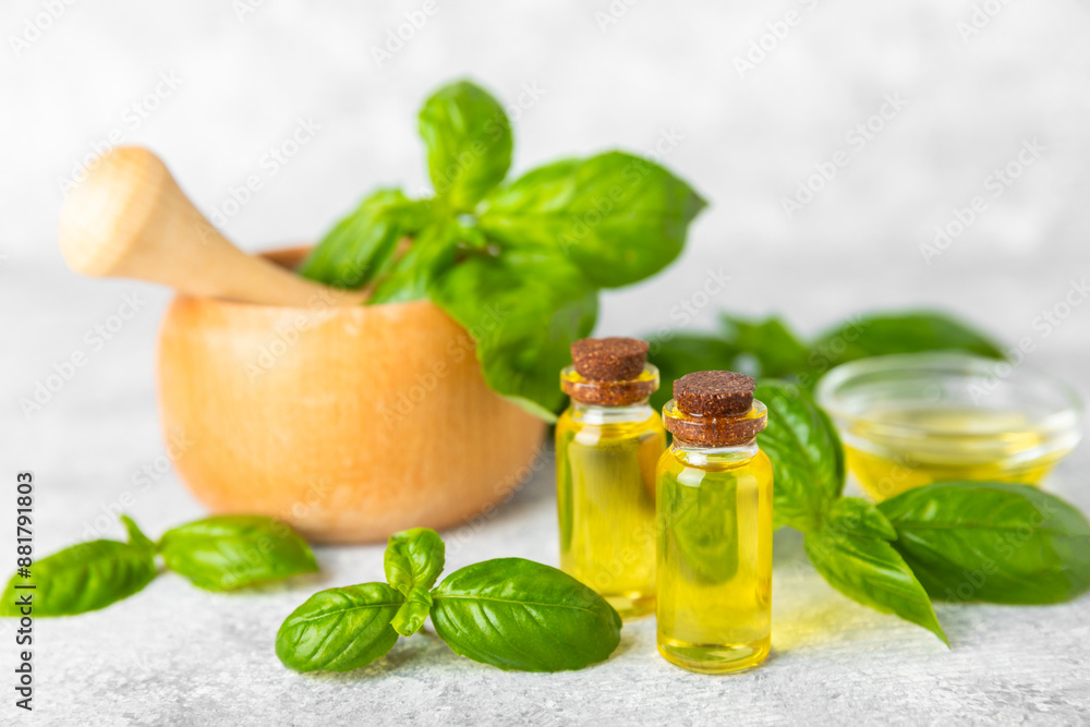 Basil essential oil on a textured wooden background. Basil essential oil and fresh leaves. Aromatherapy. Aroma oil. Medical herbs. Alternative medicine. Place for text. Copy space. Basil essential oil on a textured wooden background. Basil essential oil and fresh leaves. Aromatherapy. Aroma oil. Medical herbs. Alternative medicine. Place for text. Copy space.
